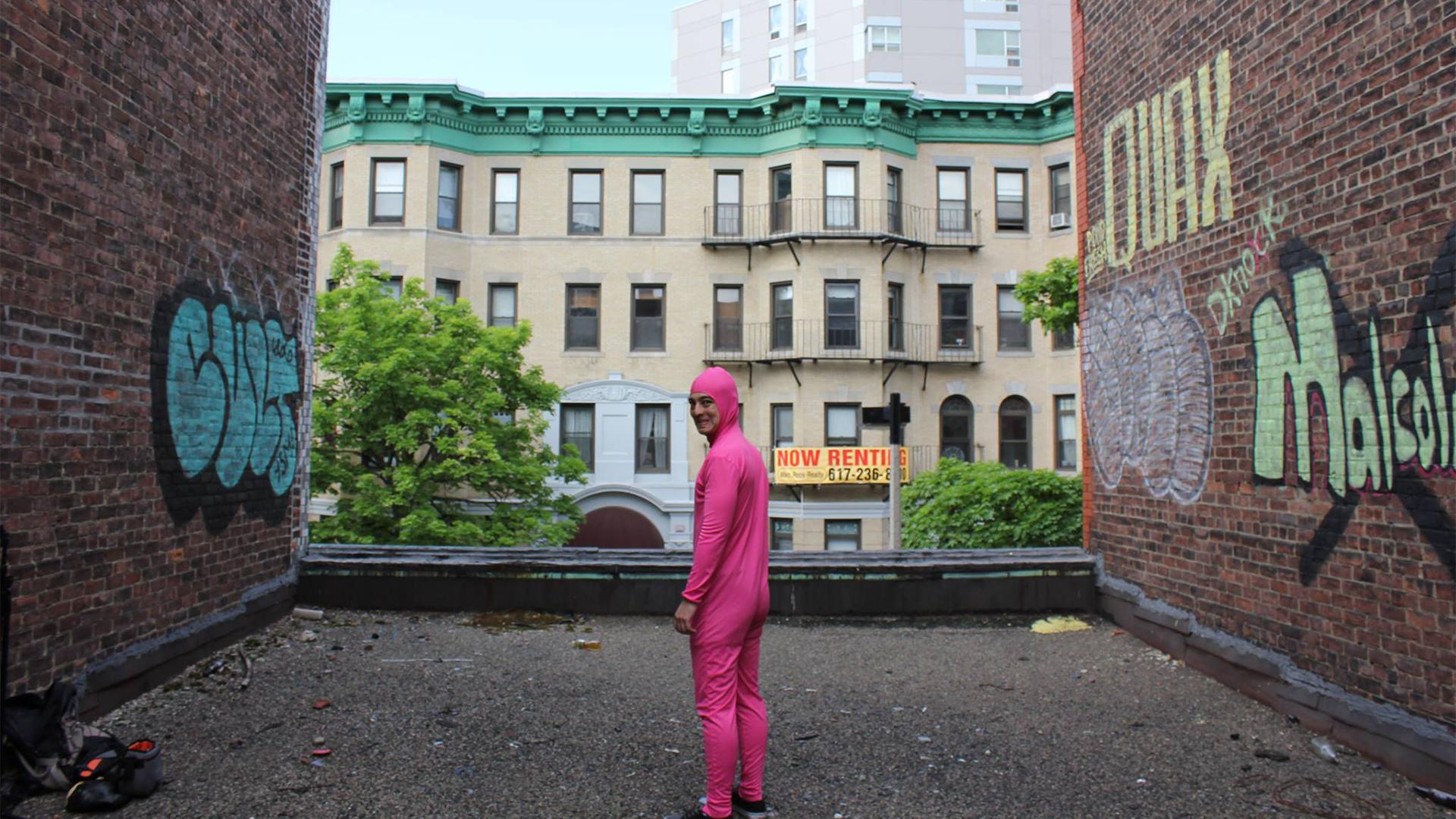 pink guy wallpaper,pink,outerwear,building,architecture,house