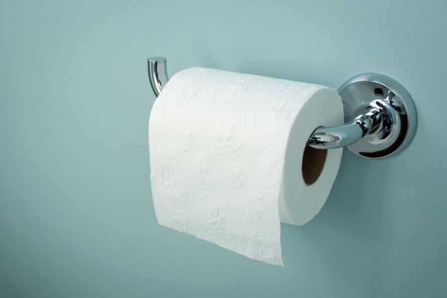 Toilet Paper On A Rack On Blue Wall Toilet Paper WallpaperUse