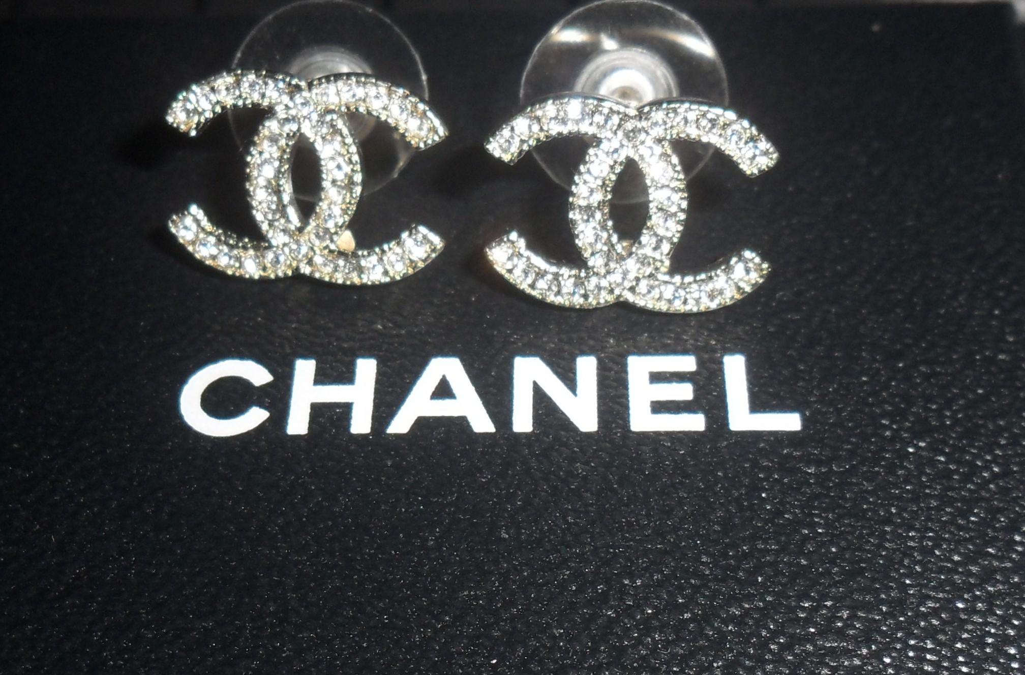 chanel wallpaper,text,font,fashion accessory,logo,jewellery