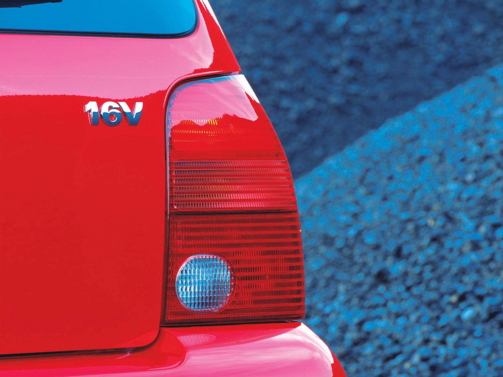 fondo de pantalla de lupo,vehículo terrestre,vehículo,coche,rojo,luz de freno y cola automotriz