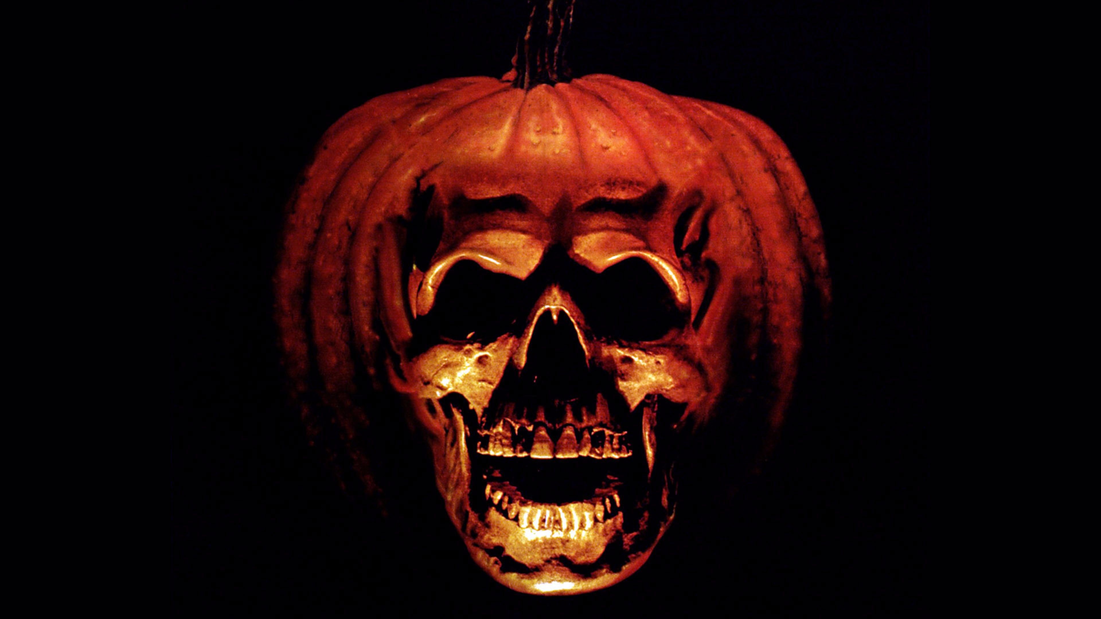 sfondo di halloween michael myers,zucca,intaglio,cranio,arancia,jack o lantern