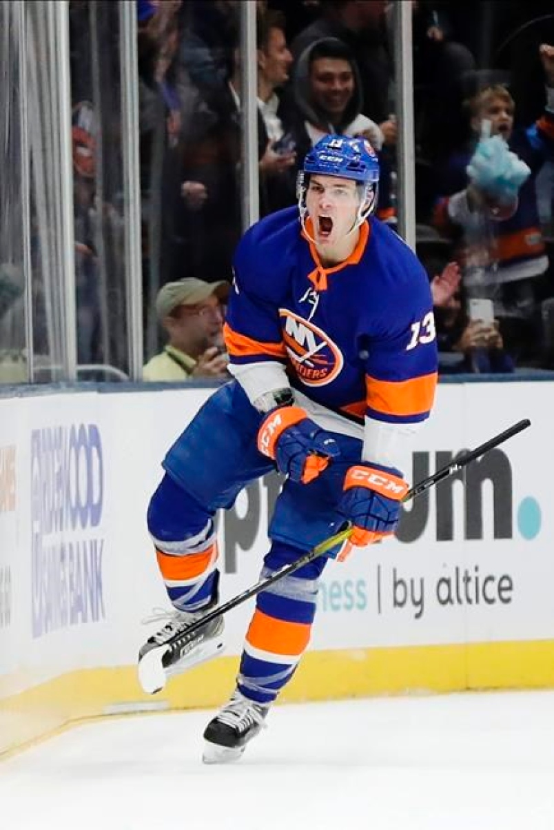 carta da parati di new york islanders,equipaggiamento protettivo per hockey,giocatore,hockey su ghiaccio del college,hockey su ghiaccio,maglia