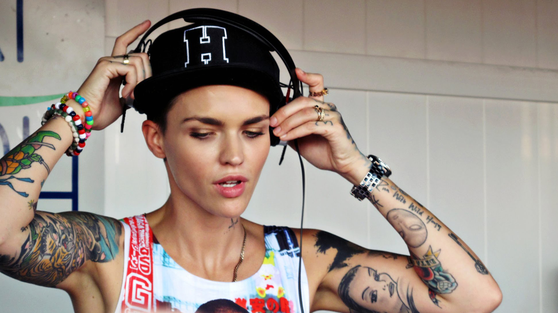 ruby rose wallpaper hd,tattoo,audio equipment,arm,beauty,headphones