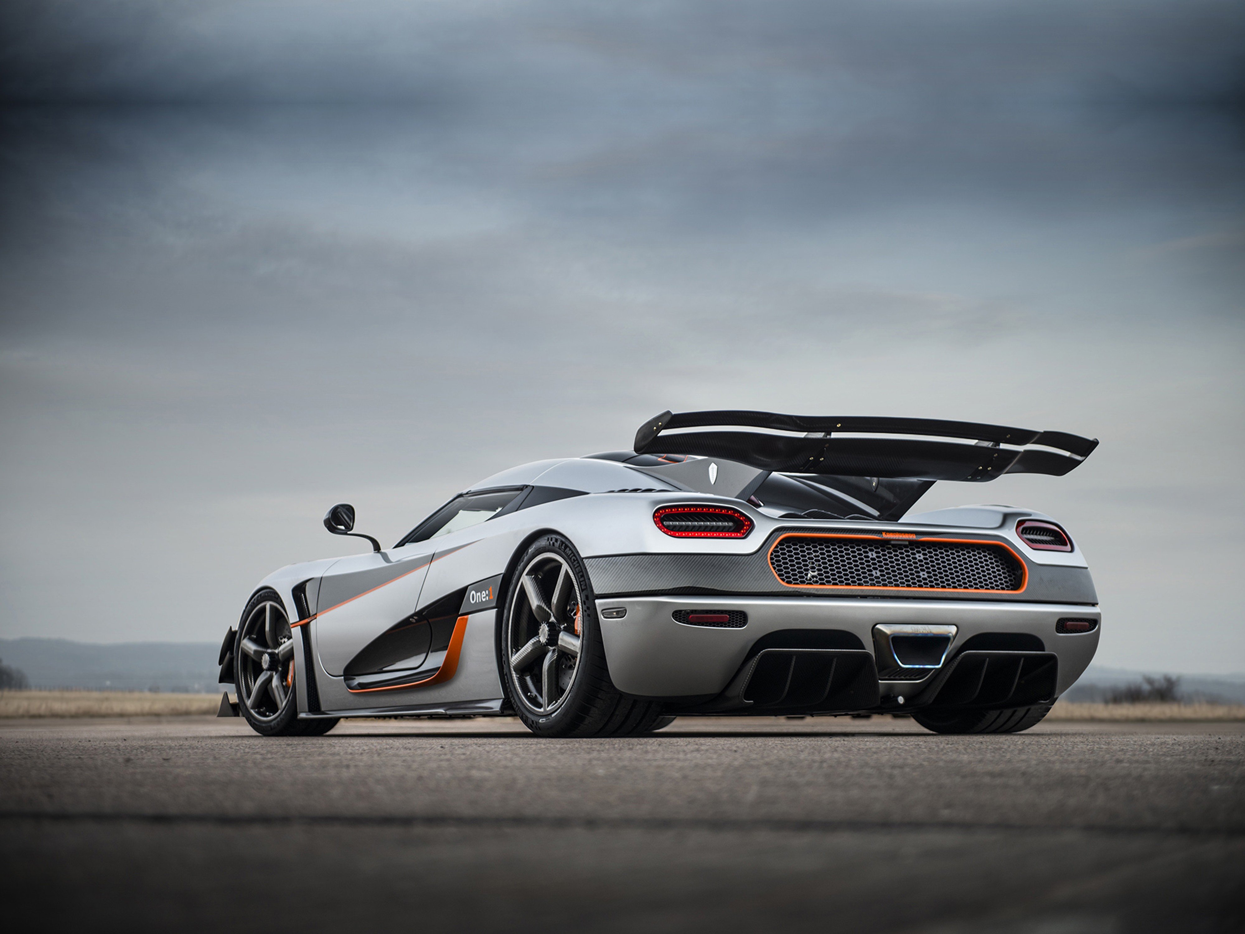 koenigsegg logo wallpaper,land vehicle,vehicle,car,sports car,automotive design