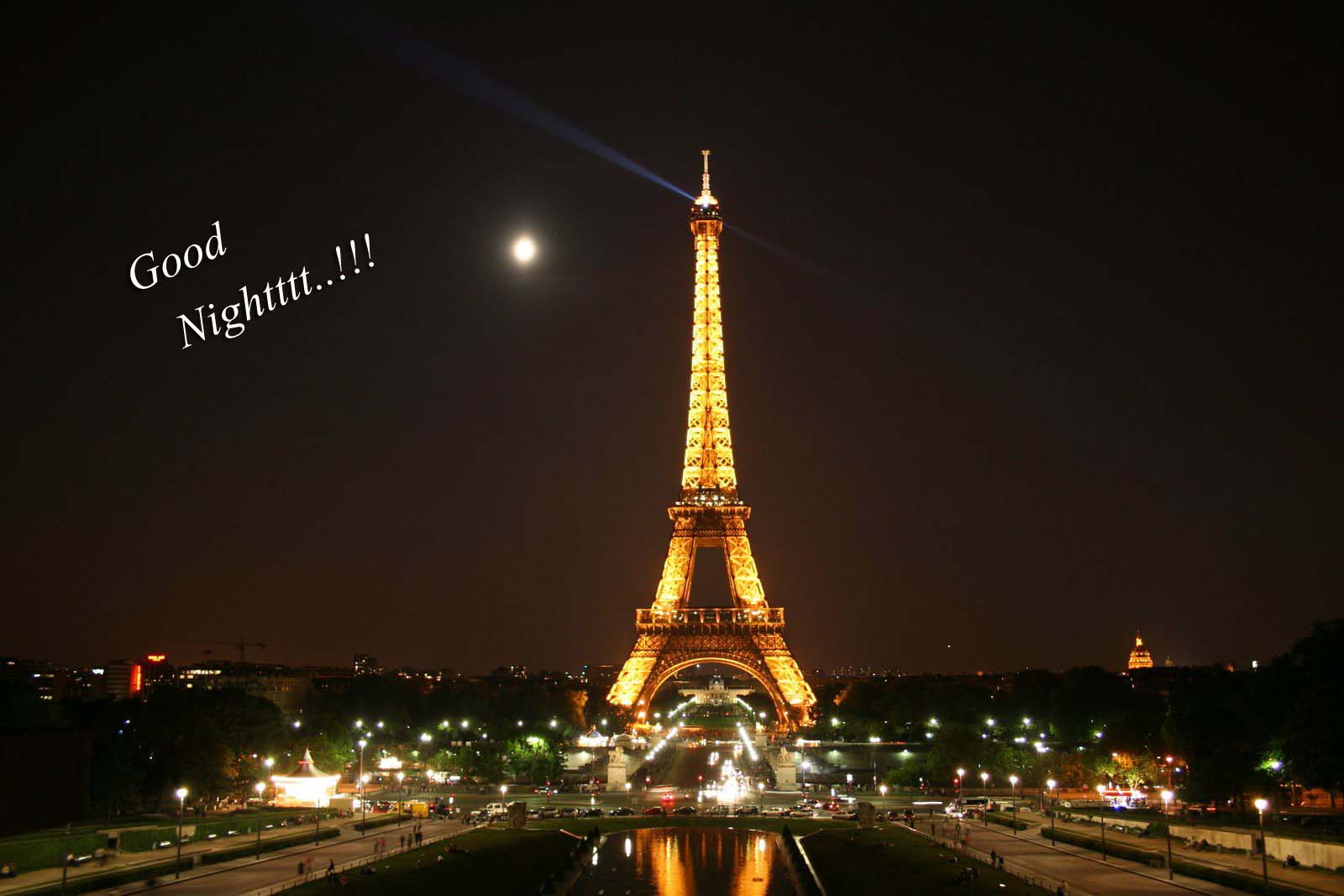 eiffel tower at night wallpaper,landmark,night,tower,metropolitan area,city