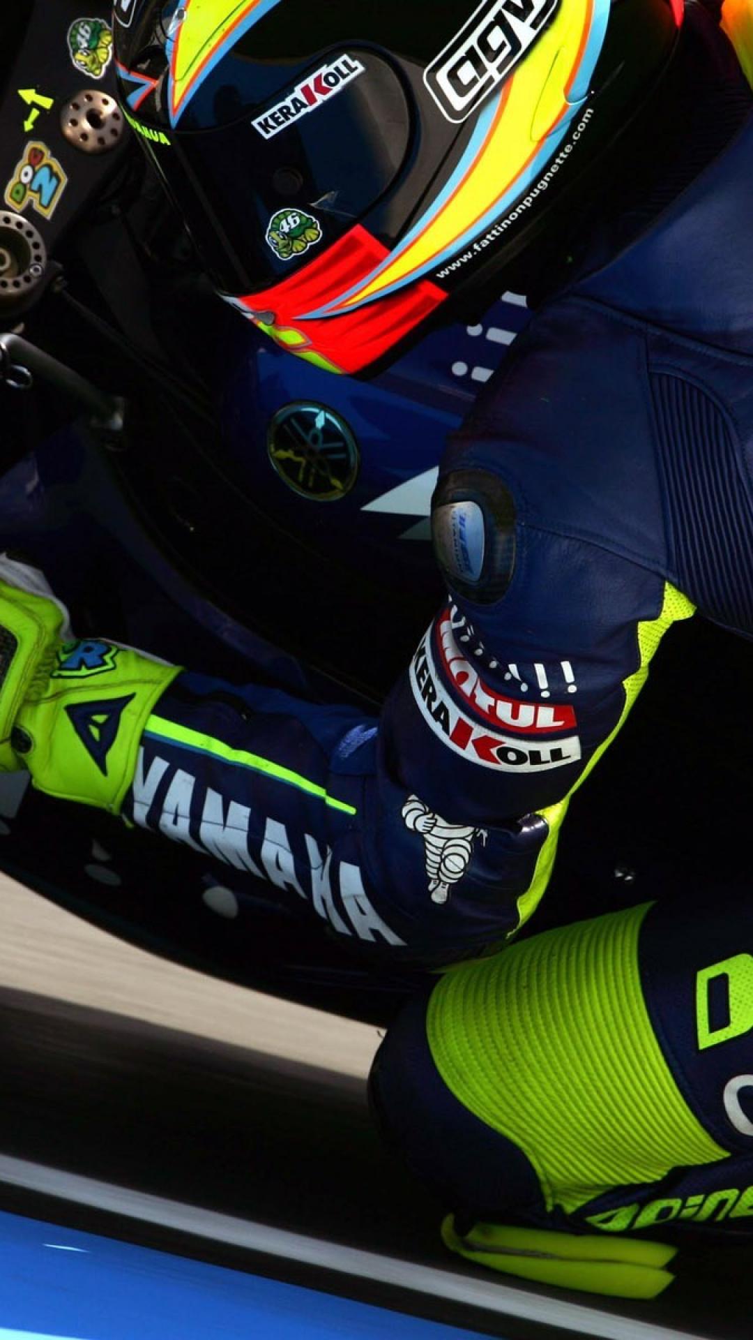 rossi wallpaper iphone,helmet,motorcycle racer,personal protective equipment,vehicle,motorcycle helmet