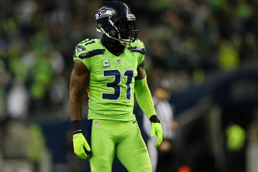 kam chancellor wallpaper,helmet,player,american football,green,sports gear