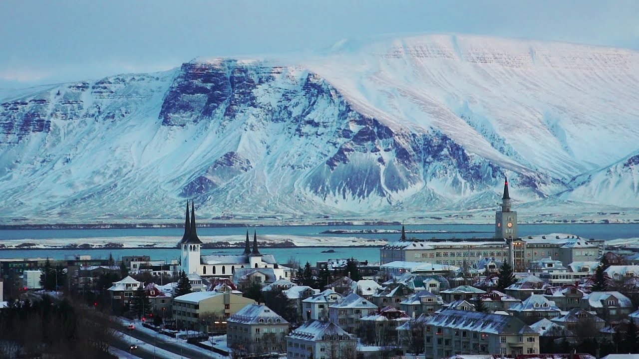 reykjavik wallpaper,mountain,mountain range,mountainous landforms,town,water