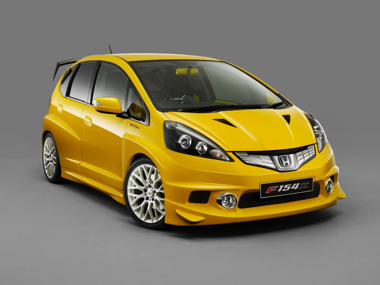 fond d'écran honda jazz,véhicule terrestre,véhicule,voiture,jaune,honda fit