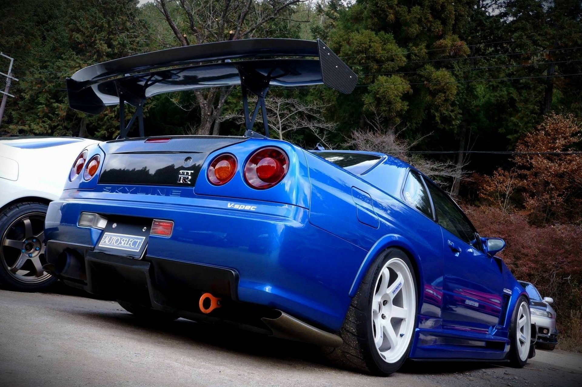 nissan skyline r34 wallpaper hd,land vehicle,vehicle,car,sports car,supercar