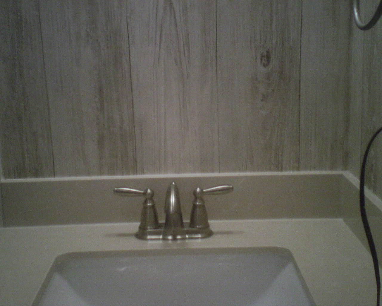 wallpaper that looks like wood paneling,sink,bathroom sink,tap,property,tile