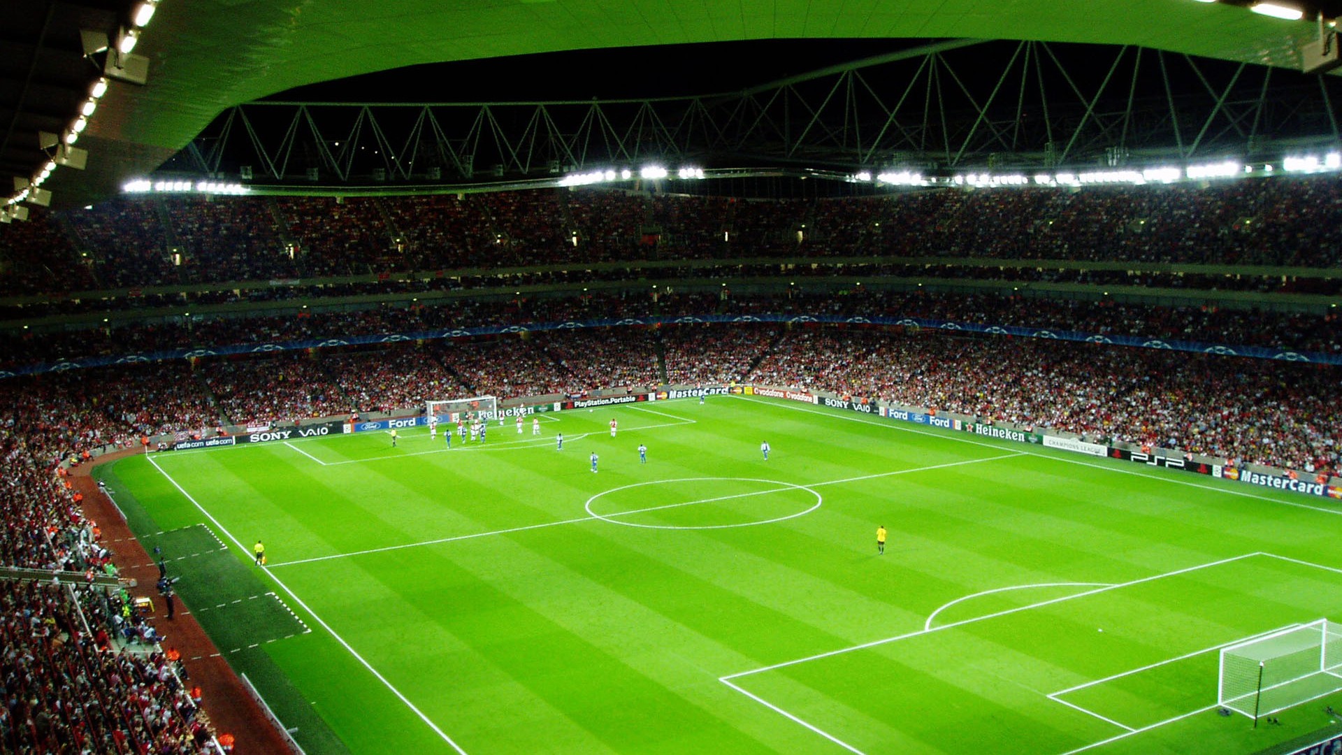 fond d'écran de terrain de football,stade,stade spécifique au football,herbe,gazon artificiel,public