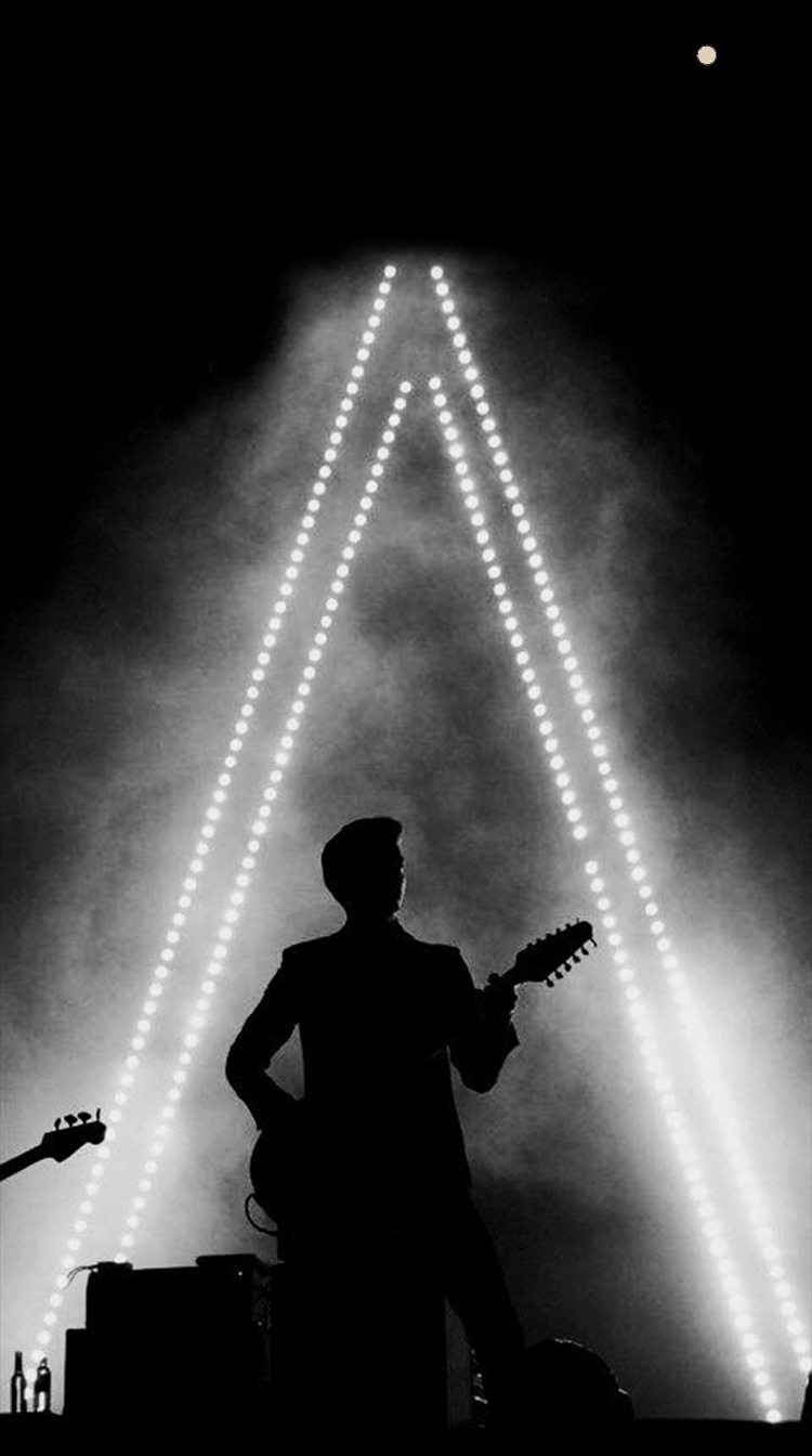 arctic monkeys iphone wallpaper,light,darkness,performance,photography,black and white