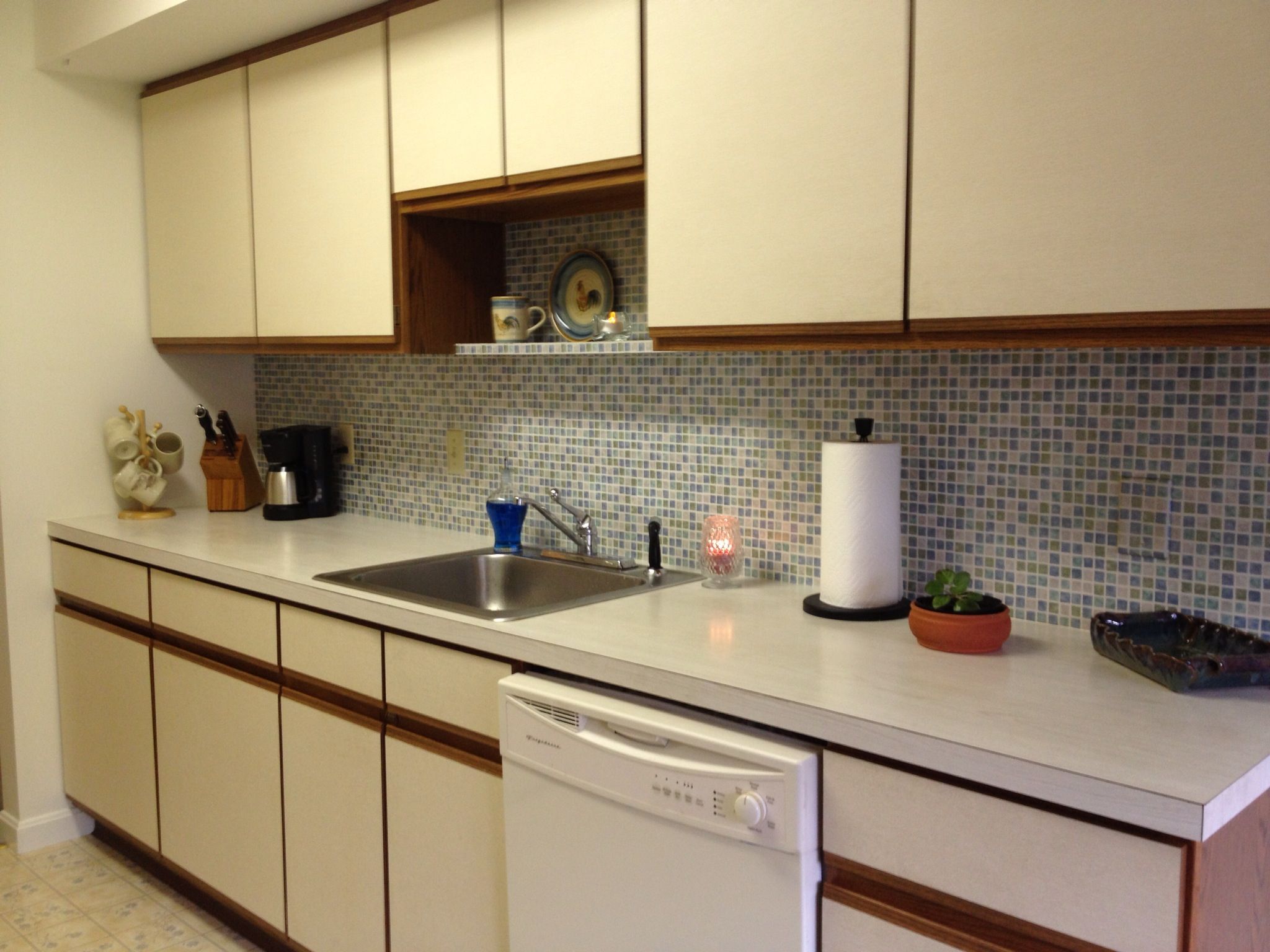 faux tile wallpaper backsplash,countertop,property,room,cabinetry,kitchen
