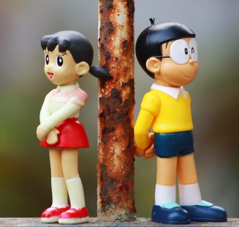 nobita shizuka love wallpapers,figurine,toy,cartoon,action figure,friendship