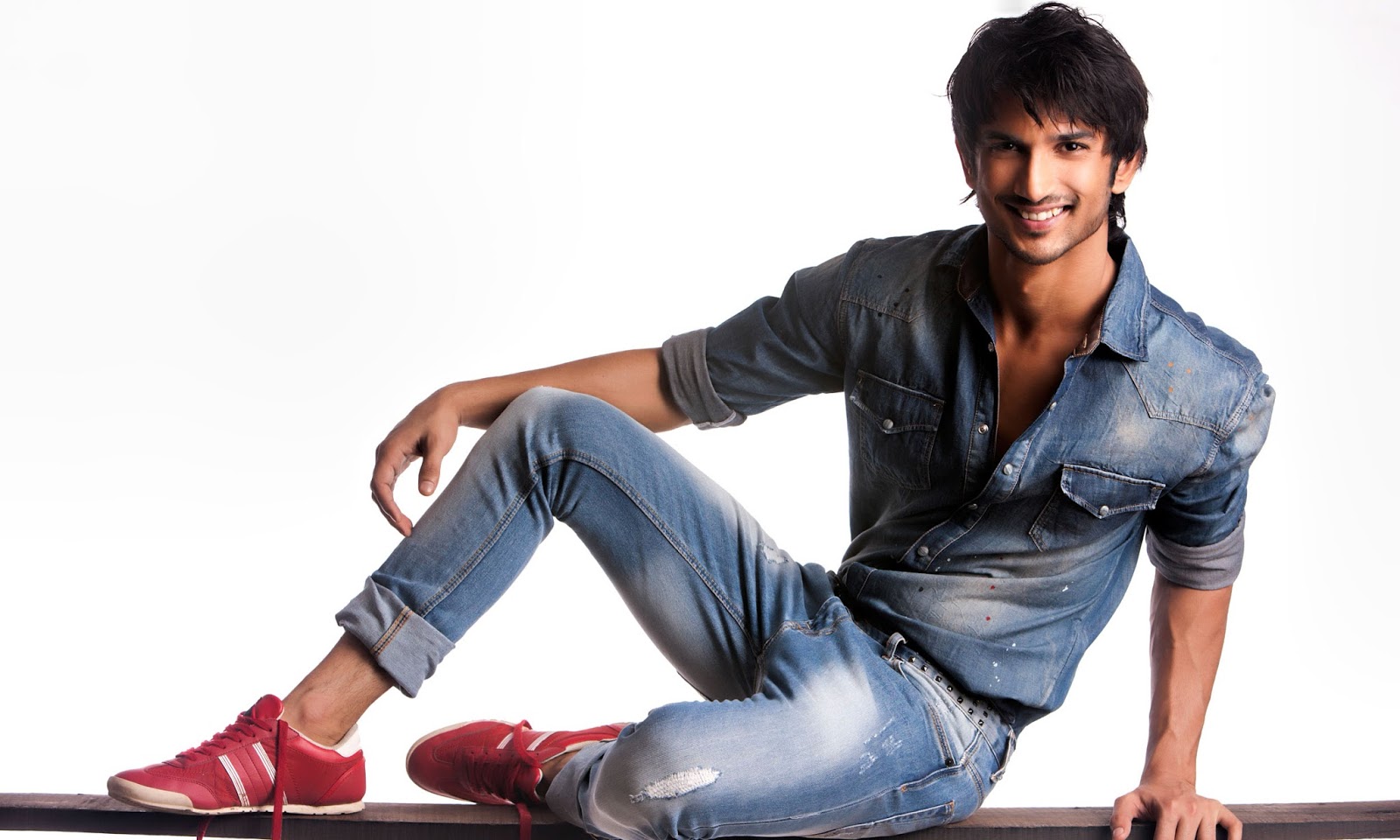 sushant singh rajput hd wallpaper,jeans,denim,sitting,clothing,cool