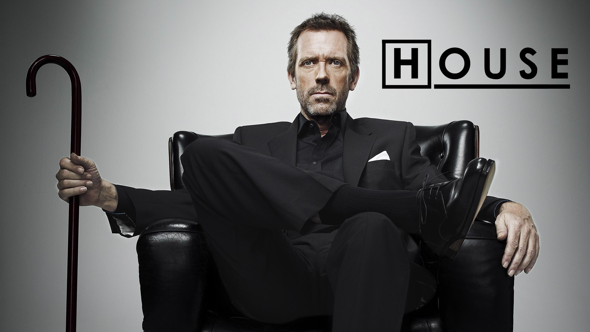 dr house wallpaper,sitting,facial hair,suit,chair,leg