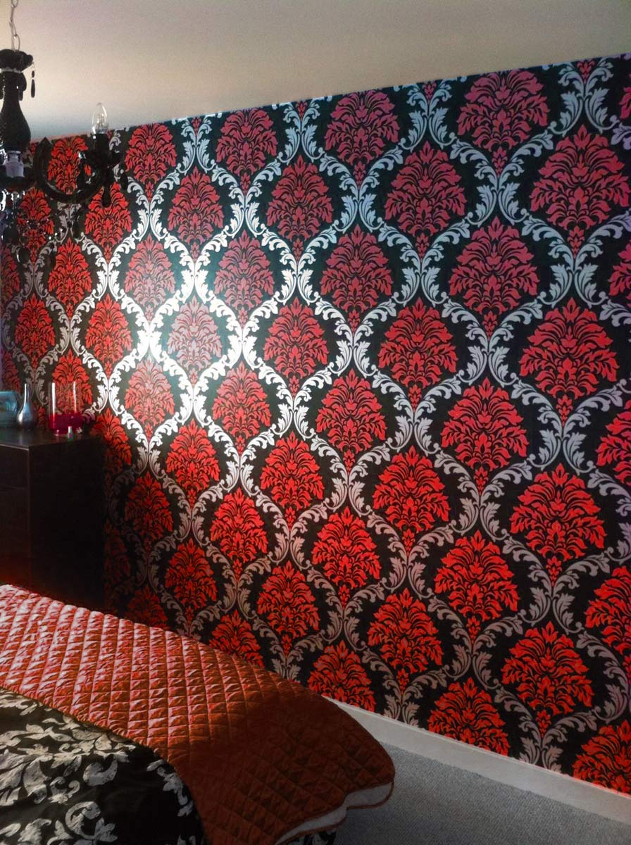 red living room wallpaper,red,orange,brown,textile,pattern