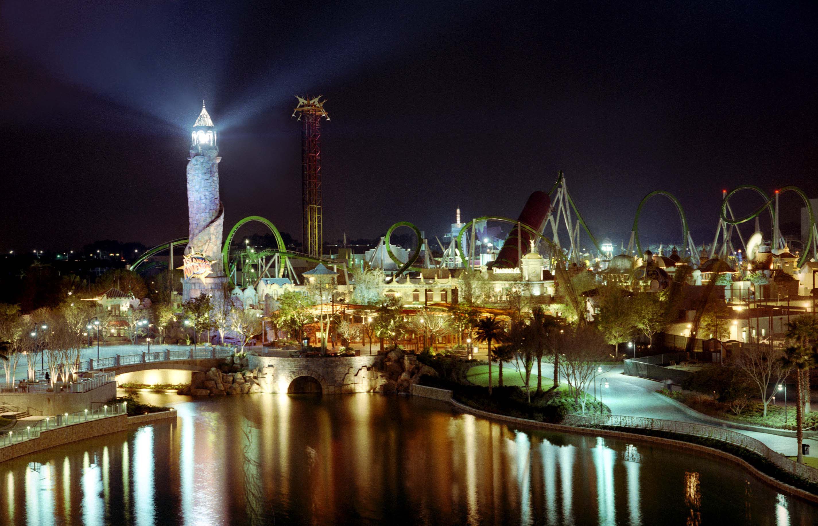 universal studios wallpaper,night,reflection,landmark,city,light