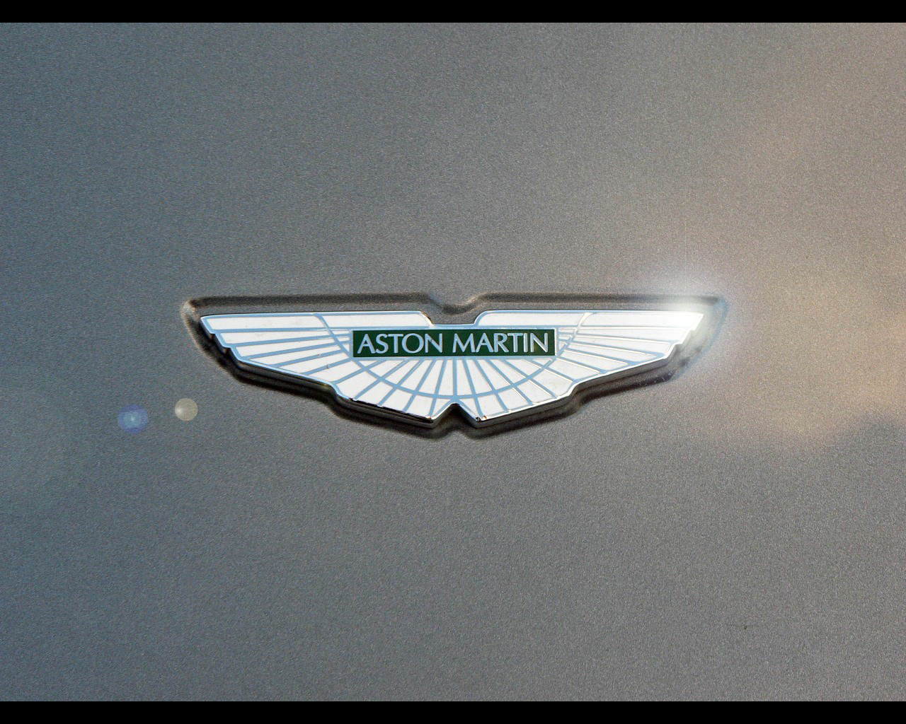 aston martin logo wallpaper,vehicle,emblem,car,badge,logo