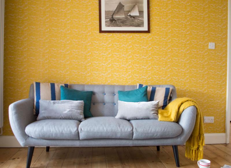 modern yellow wallpaper,furniture,yellow,couch,room,living room