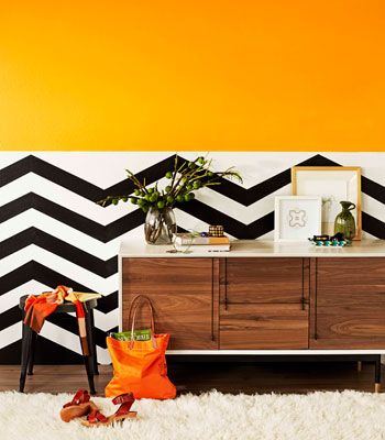wallpaper on bottom half of wall,orange,furniture,table,room,interior design