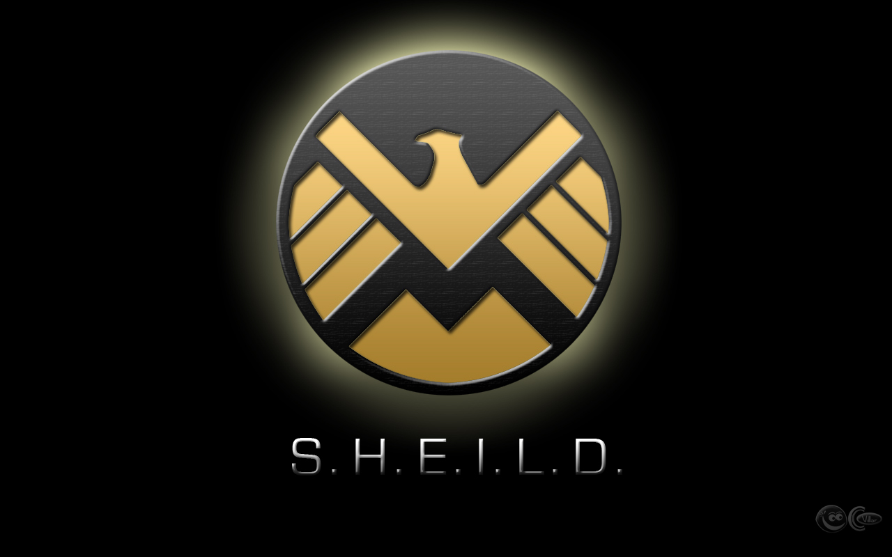the shield wallpaper,logo,yellow,text,font,trademark