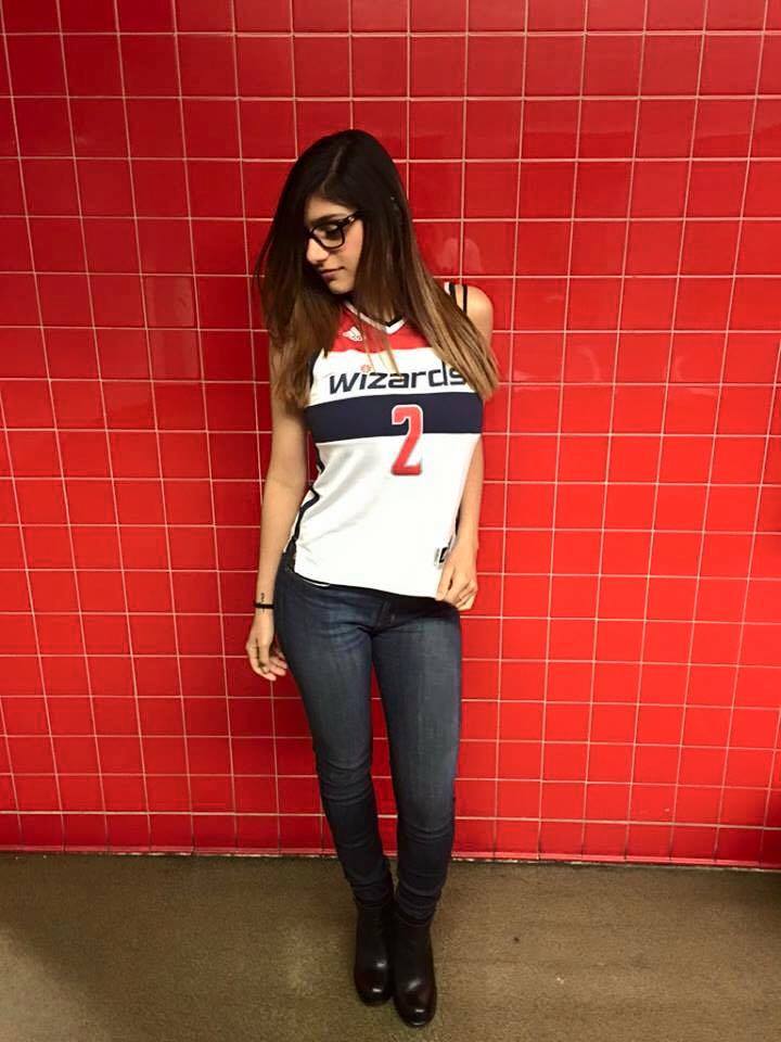 mia khalifa wallpaper,clothing,red,t shirt,jeans,leg