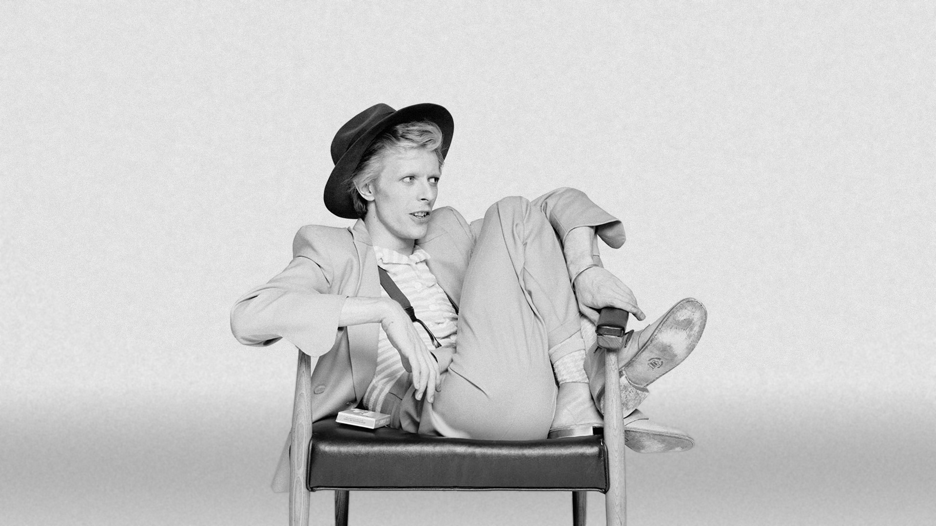 david bowie wallpaper,white,sitting,black and white,photography,monochrome