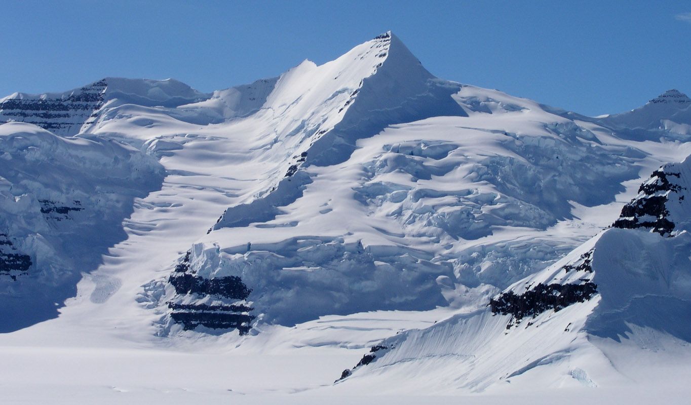 snow mountain wallpaper,mountainous landforms,mountain,glacial landform,mountain range,nunatak