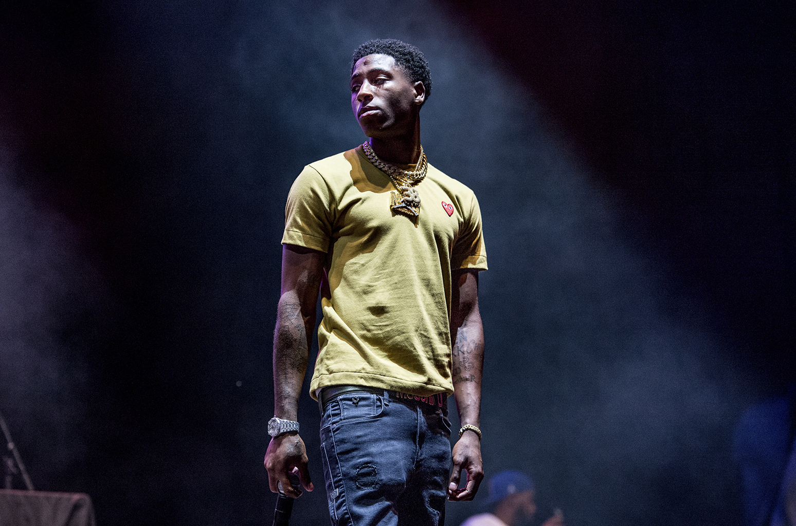 nba youngboy wallpaper,performance,yellow,performing arts,cheek,stage