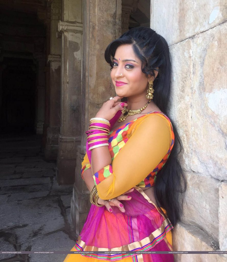 bhojpuri actress wallpaper,clothing,photo shoot,abdomen,pink,yellow